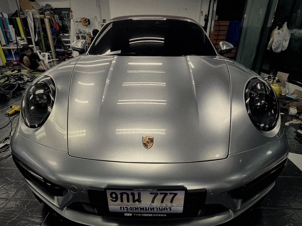 Finished Porsche front end with protective coating, glossy result